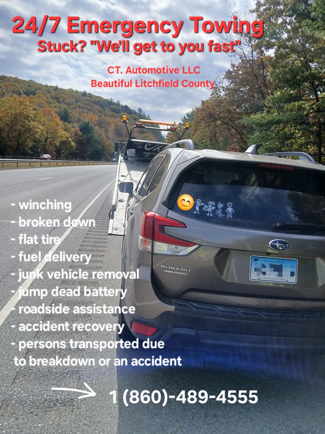 CT. Automotive flatbed tow truck loading a vehicle on a Litchfield County highway in autumn; the company's own advertisement text is printed across the photo
